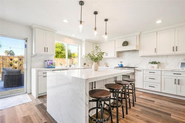 4326 Forest Ranch Rd, Oceanside, CA 92057 - kitchen featuring backsplash, a kitchen island, white cabinets, light wood-style floors, and recessed lighting