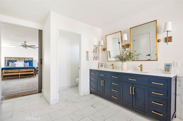 4326 Forest Ranch Rd, Oceanside, CA 92057 - ensuite bathroom with marble finish floors, double vanity, toilet, baseboards, and ceiling fan