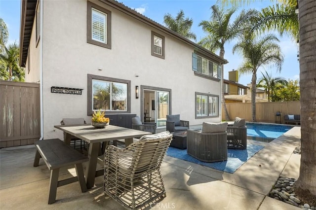 4326 Forest Ranch Rd, Oceanside, CA 92057 - rear view of house with outdoor lounge area, a patio area, a fenced backyard, stucco siding, and outdoor dining area