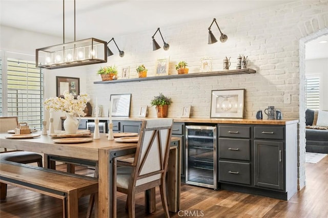 4326 Forest Ranch Rd, Oceanside, CA 92057 - bar featuring wine cooler, dark wood-style flooring, a chandelier, and pendant lighting