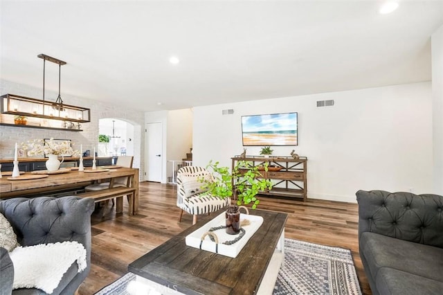 4326 Forest Ranch Rd, Oceanside, CA 92057 - living room featuring arched walkways, wood finished floors, and recessed lighting