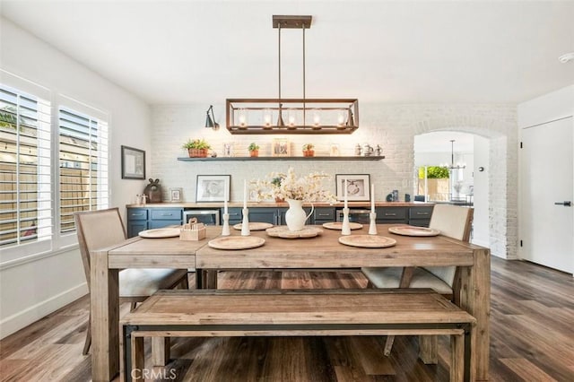 4326 Forest Ranch Rd, Oceanside, CA 92057 - dining room featuring wood finished floors, a chandelier, and arched walkways
