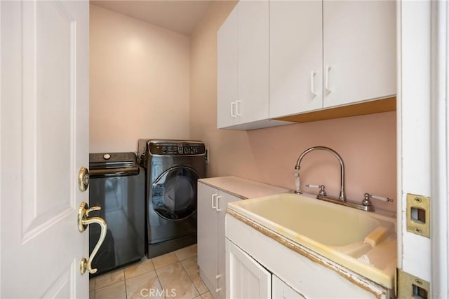10610 Oak Tree Way, Sunland, CA 91040 - laundry area featuring cabinet space, washing machine and clothes dryer, and light tile patterned floors