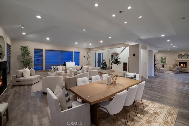 3141 Hillrose Dr, Rossmoor, CA 90720 - dining area with a warm lit fireplace, recessed lighting, wood finished floors, and baseboards
