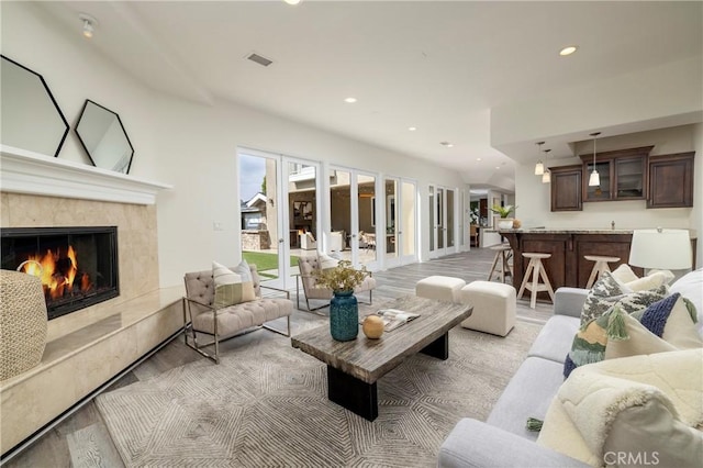 3141 Hillrose Dr, Rossmoor, CA 90720 - living room with a premium fireplace, light wood finished floors, and recessed lighting