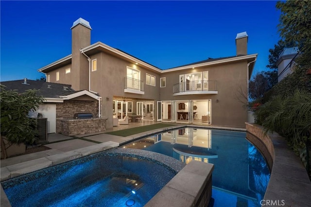 3141 Hillrose Dr, Rossmoor, CA 90720 - back of house featuring area for grilling, a balcony, a chimney, and a patio area