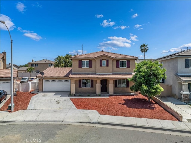 1568 Burns Ln, San Jacinto, CA 92335 - view of front facade featuring a tile roof, stucco siding, an attached garage, concrete driveway, and a porch