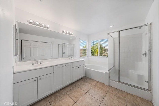 1568 Burns Ln, San Jacinto, CA 92335 - bathroom featuring double vanity, a bath, a stall shower, tile patterned flooring, and recessed lighting