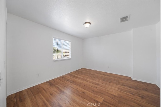1568 Burns Ln, San Jacinto, CA 92335 - empty room featuring wood finished floors and baseboards