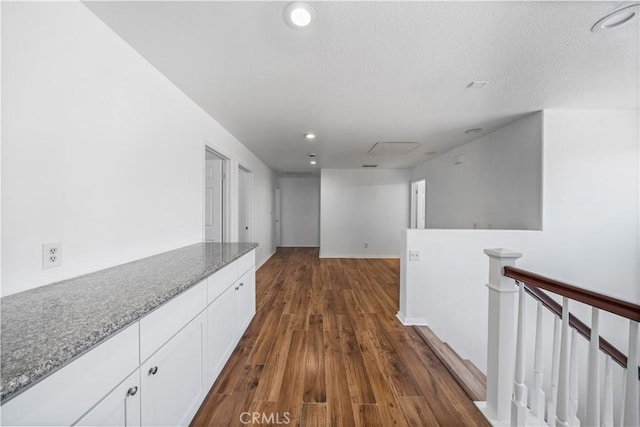 1568 Burns Ln, San Jacinto, CA 92335 - hall featuring an upstairs landing, dark wood finished floors, recessed lighting, and a textured ceiling