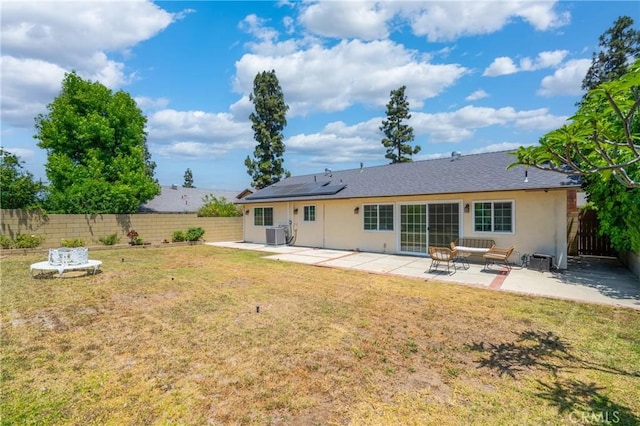 2215 Calmette Ave, Rowland Heights, CA 91748 - rear view of house with stucco siding, a fenced backyard, solar panels, and a patio