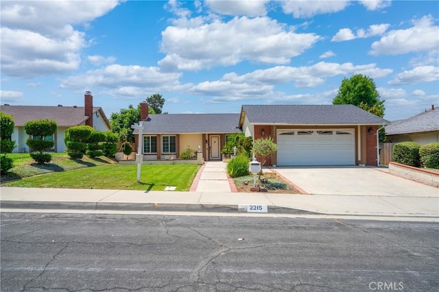 2215 Calmette Ave, Rowland Heights, CA 91748 - view of front facade with driveway, a garage, and a front yard