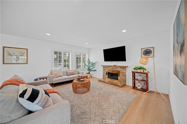 2215 Calmette Ave, Rowland Heights, CA 91748 - living room featuring light wood-type flooring, a premium fireplace, and recessed lighting