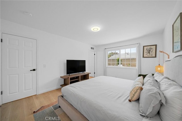 2215 Calmette Ave, Rowland Heights, CA 91748 - bedroom featuring wood finished floors and baseboards