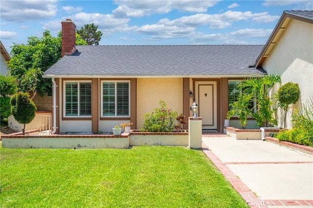2215 Calmette Ave, Rowland Heights, CA 91748 - view of front of house featuring stucco siding, roof with shingles, a chimney, and a front lawn