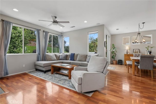 103 Corte Tierra Bella, San Clemente, CA 92673 - living room with plenty of natural light, a chandelier, light wood finished floors, and recessed lighting