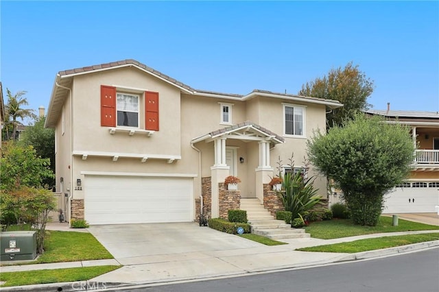 103 Corte Tierra Bella, San Clemente, CA 92673 - view of front of property with a garage, driveway, stone siding, and stucco siding