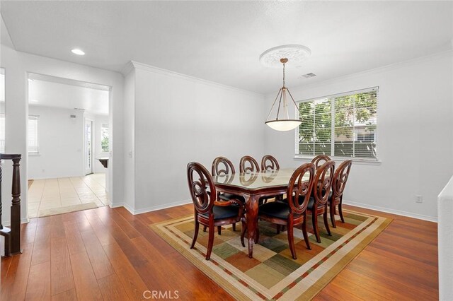 30185 Tenaya Ln, Highland, CA 92346 - dining area featuring hardwood / wood-style flooring, healthy amount of natural light, baseboards, recessed lighting, and ornamental molding