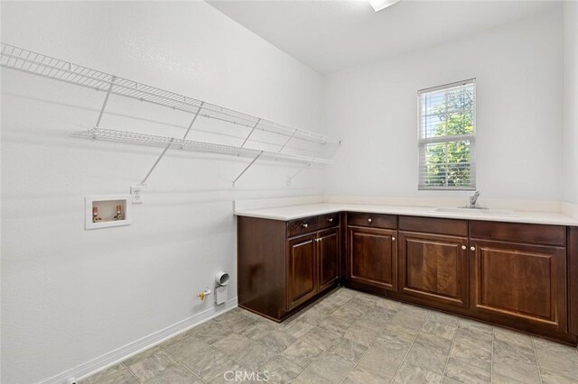 30185 Tenaya Ln, Highland, CA 92346 - laundry room with hookup for a washing machine, hookup for a gas dryer, and cabinet space