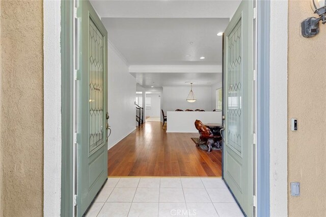 30185 Tenaya Ln, Highland, CA 92346 - foyer with a textured wall, ornamental molding, light tile patterned floors, recessed lighting, and baseboards