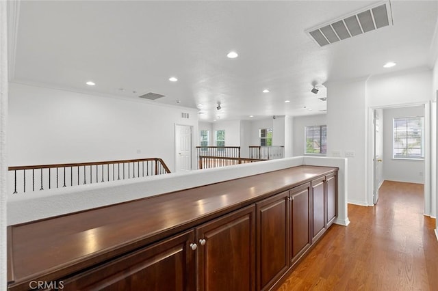 30185 Tenaya Ln, Highland, CA 92346 - hallway featuring recessed lighting, plenty of natural light, light wood finished floors, and baseboards