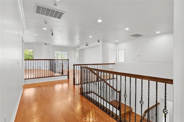 30185 Tenaya Ln, Highland, CA 92346 - hall with an upstairs landing, wood finished floors, recessed lighting, and baseboards