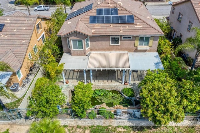 30185 Tenaya Ln, Highland, CA 92346 - rear view of house with stucco siding and solar panels