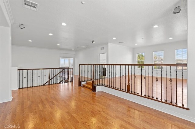 30185 Tenaya Ln, Highland, CA 92346 - unfurnished room with recessed lighting, wood finished floors, baseboards, and ornamental molding
