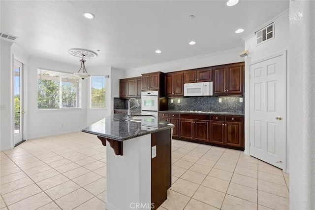 30185 Tenaya Ln, Highland, CA 92346 - kitchen featuring white appliances, light tile patterned floors, backsplash, a sink, and crown molding