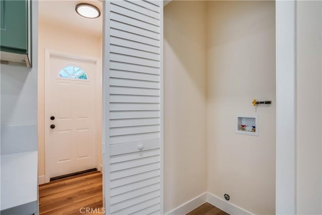 9331 Hunt Ave, South Gate, CA 90280 - washroom with hookup for a washing machine, wood finished floors, and baseboards