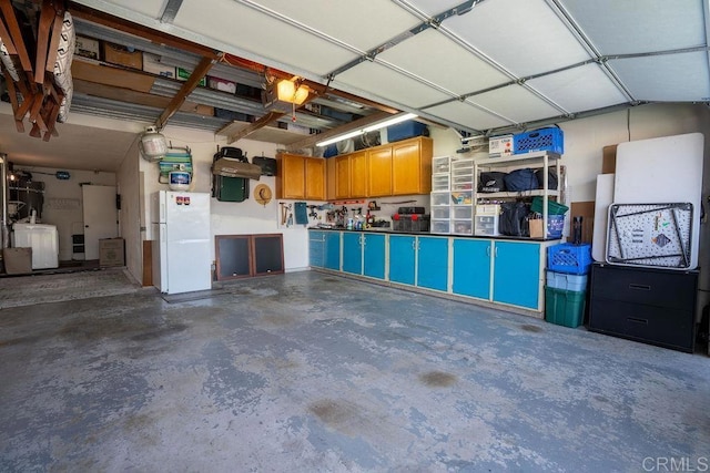 1302 El Corral Ln, San Marcos, CA 92078 - garage with freestanding refrigerator and washer / clothes dryer