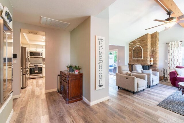 1302 El Corral Ln, San Marcos, CA 92078 - living area featuring light wood-style floors, ceiling fan, and vaulted ceiling