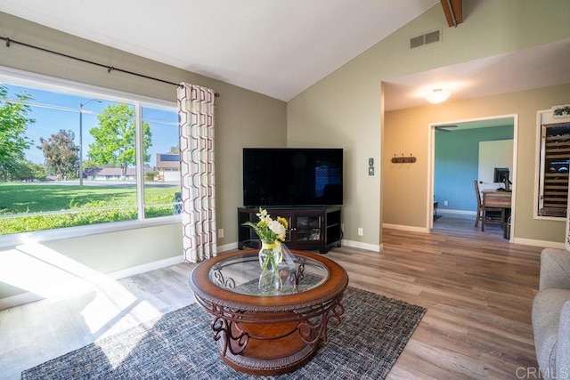 1302 El Corral Ln, San Marcos, CA 92078 - living area featuring wood finished floors, a desk, and high vaulted ceiling