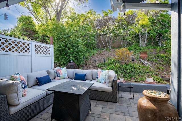 1302 El Corral Ln, San Marcos, CA 92078 - fenced backyard featuring an outdoor living space with a fire pit and a patio area