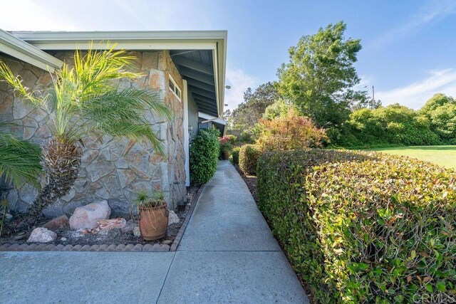 1302 El Corral Ln, San Marcos, CA 92078 - view of side of property with stone siding