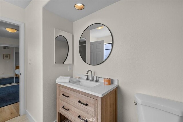 320 W 19th St Unit 1, San Pedro, CA 90731 - bathroom featuring toilet, vanity, and baseboards