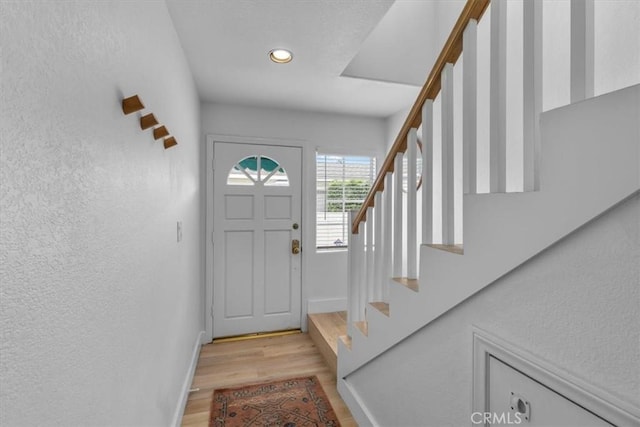 320 W 19th St Unit 1, San Pedro, CA 90731 - foyer entrance with light wood-style floors, stairway, baseboards, a textured wall, and recessed lighting