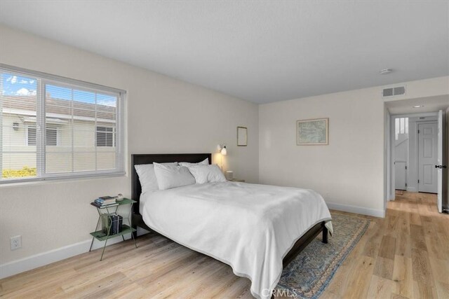 320 W 19th St Unit 1, San Pedro, CA 90731 - bedroom featuring baseboards and light wood-style floors