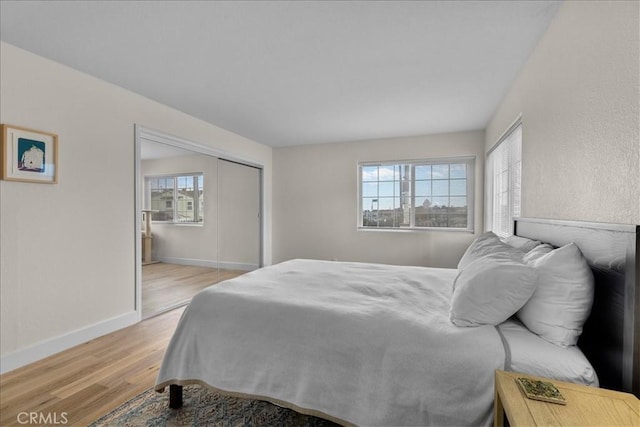 320 W 19th St Unit 1, San Pedro, CA 90731 - bedroom featuring light wood finished floors, baseboards, and a closet