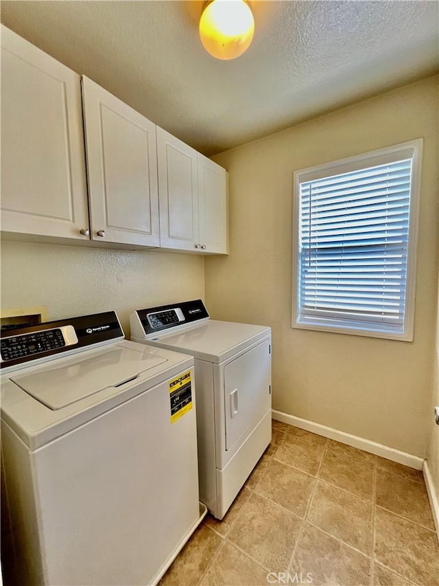 5890 Kendrick Dr, Riverside, CA 92507 - laundry area with washing machine and dryer, cabinet space, baseboards, and a textured ceiling