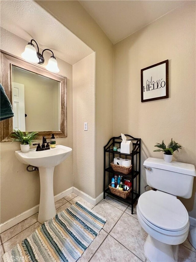 5890 Kendrick Dr, Riverside, CA 92507 - bathroom with toilet, tile patterned flooring, and baseboards