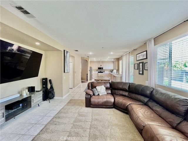 5890 Kendrick Dr, Riverside, CA 92507 - living area featuring light tile patterned flooring, recessed lighting, and baseboards