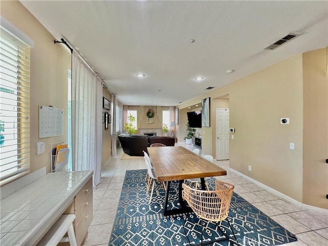 5890 Kendrick Dr, Riverside, CA 92507 - dining space featuring light tile patterned floors, baseboards, and recessed lighting