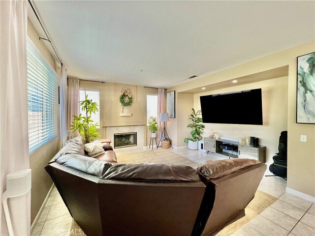 5890 Kendrick Dr, Riverside, CA 92507 - living room with baseboards, light tile patterned floors, and a fireplace