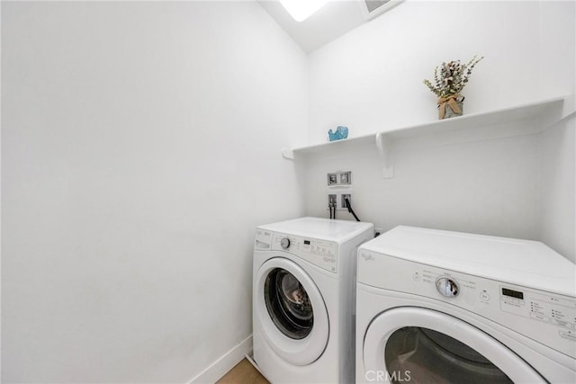 182 Frontier, Irvine, CA 92620 - washroom with washing machine and clothes dryer and baseboards