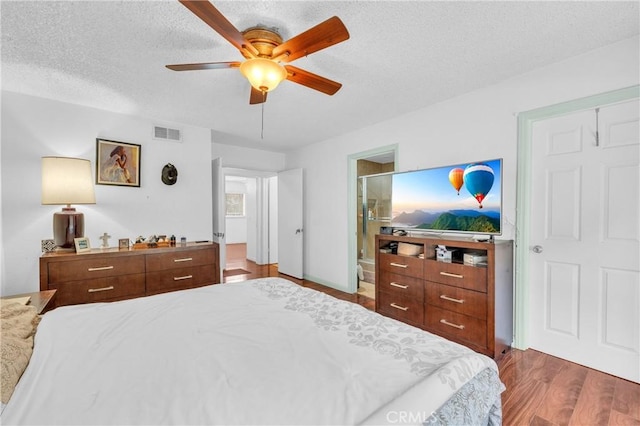 20043 Emerald Meadow Dr, Walnut, CA 91789 - bedroom featuring wood finished floors, a textured ceiling, ceiling fan, and connected bathroom