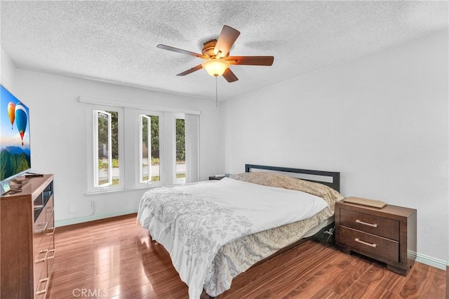 20043 Emerald Meadow Dr, Walnut, CA 91789 - bedroom featuring wood finished floors, a textured ceiling, baseboards, and a ceiling fan