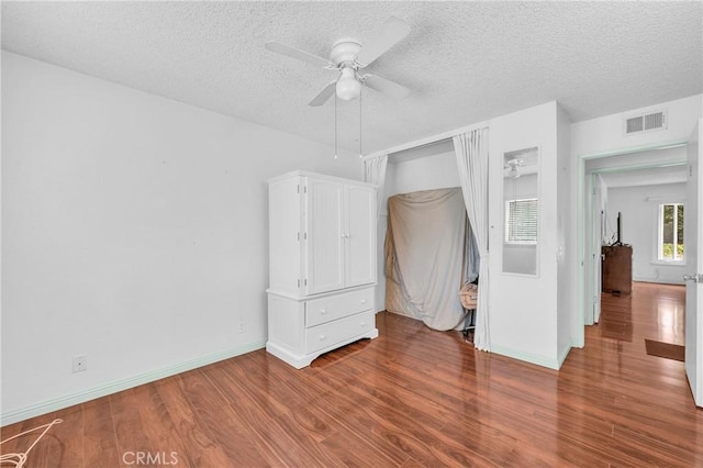 20043 Emerald Meadow Dr, Walnut, CA 91789 - unfurnished bedroom featuring wood finished floors, a textured ceiling, baseboards, and ceiling fan