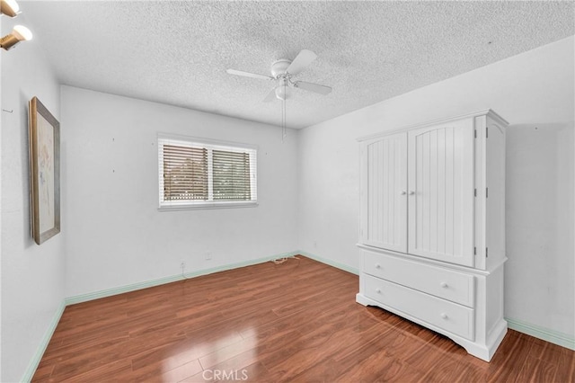 20043 Emerald Meadow Dr, Walnut, CA 91789 - unfurnished bedroom with wood finished floors, a textured ceiling, and baseboards