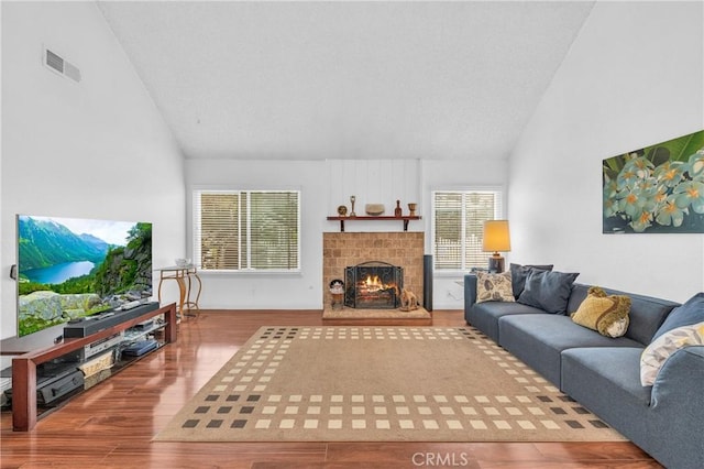 20043 Emerald Meadow Dr, Walnut, CA 91789 - living room featuring wood finished floors, a warm lit fireplace, and high vaulted ceiling